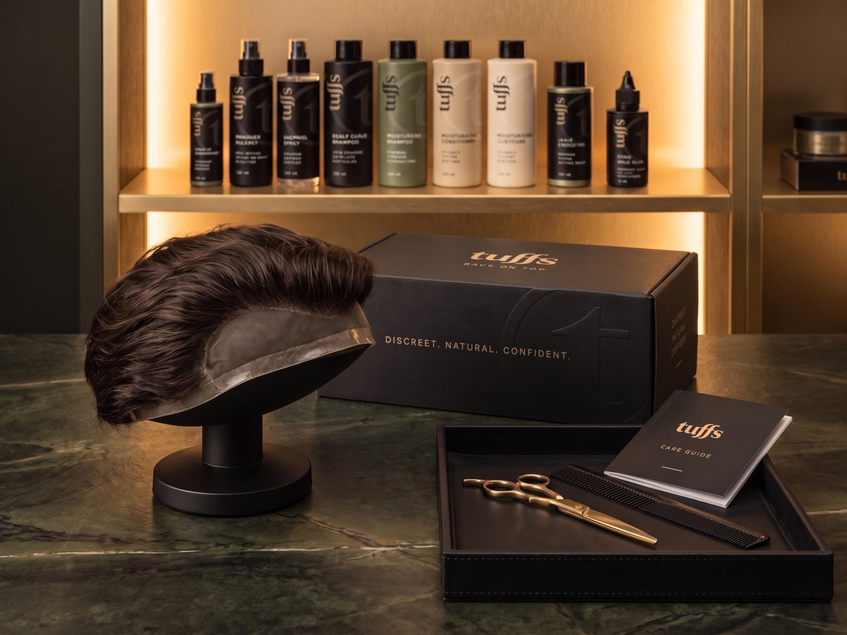 The Tuffs Starter Kit: a lace hair system on a stand with the Tuffs box, care range and tools